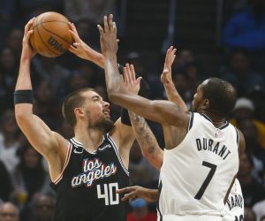 Los Angeles Clippers center Ivica Zubac (40) shoots against Brooklyn Nets guard Brooklyn Nets forward Kevin Durant (7) during an NBA basketball game Saturday, November 12, 2022, in Los Angeles. (Ringo Chiu via AP)
