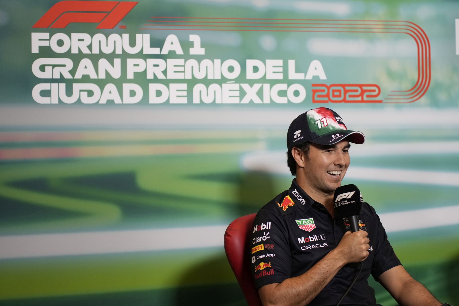 epa10270244 Mexican Formula One driver Sergio Perez of Red Bull Racing, speaks during a press conference as part of the Formula One Grand Prix of the Mexico City in Mexico City, Mexico, 27 October 2022. The Formula One Grand Prix of the Mexico City takes place on 30 October 2022 at the Circuit of Hermanos Rodriguez.  EPA/LUIS LICONA