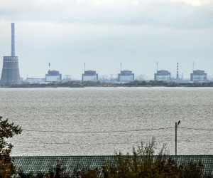 epa10271118 The Zaporizhzhia nuclear power plant (ZNPP) is seen from Nikopol, Ukraine, 28 October 2022. According to a statement by IAEA director general chief Grossi from 28 October 2022, engineers at the ZNPP have been working to stabilize the facility’s external power supplies. The plant has received the power needed to cool the reactors "directly and without interruption from the national grid," the nuclear watchdog's chief said. Russian troops on 24 February entered Ukrainian territory, starting a conflict that has provoked destruction and a humanitarian crisis.  EPA/HANNIBAL HANSCHKE