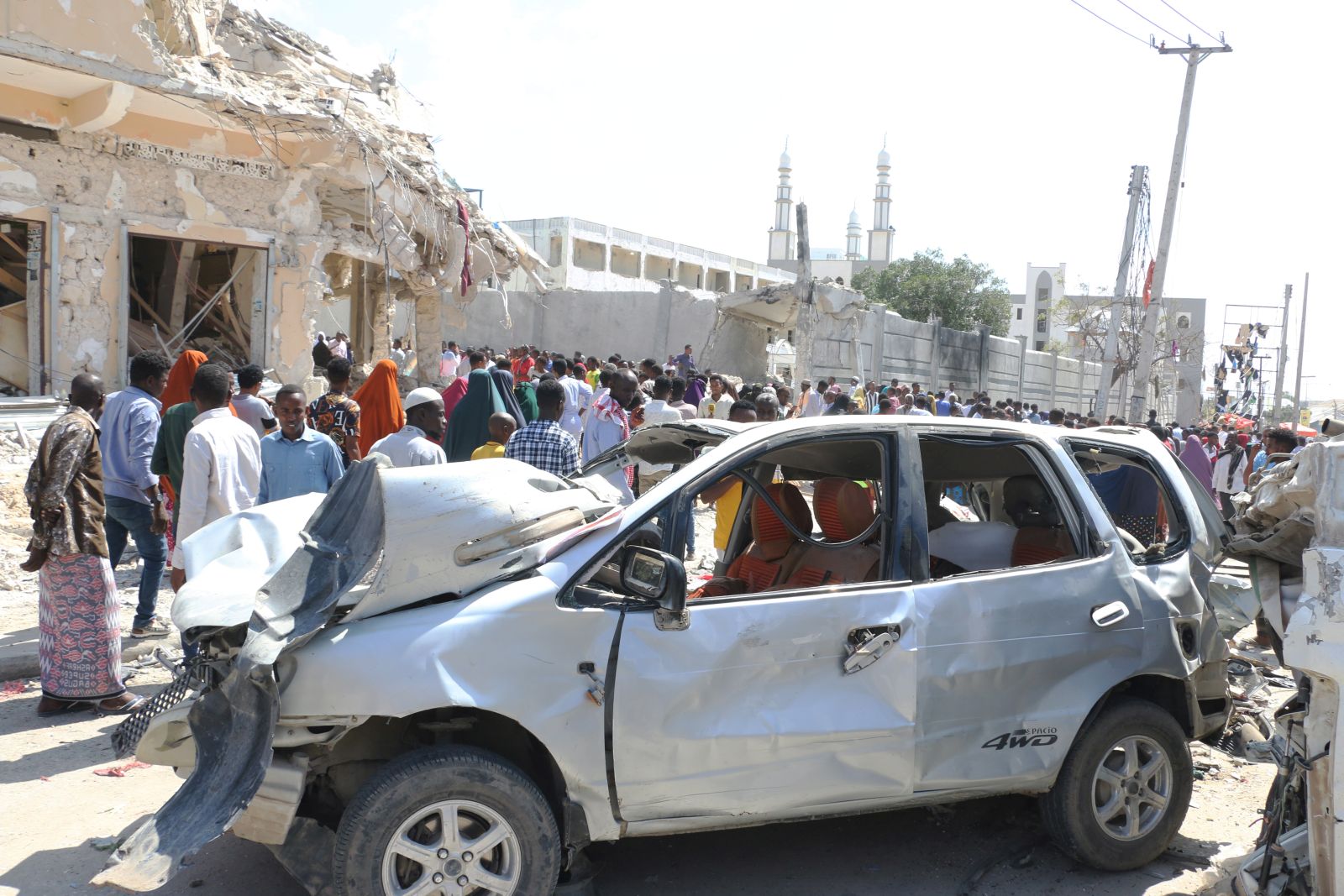 epa10274748 A damaged car in the aftermath of two explosions in Mogadishu, Somalia, 30 October 2022. At least 100 people were killed and over 300 were injured on 29 October, when two car bombs exploded at a busy junction near key government offices, Somali President Hassan Sheikh Mohamud said on 30 October during a media statement at the scene of the twin blasts. The attack occurred five years after a massive blast at the same location killed hundreds of people.  EPA/SAID YUSUF WARSAME