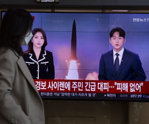 epa10280871 A woman watches the news at a station in Seoul, South Korea, 02 November 2022. According to South Korea's Joint Chiefs of Staff (JCS), North Korea launched at least three short-range ballistic missiles (SRBMs) into the East Sea, one of which flew across its de facto maritime border with South Korea.  EPA/JEON HEON-KYUN