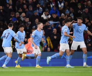 epa10282479 Manchester City's Rico Lewis celebrates with teammates after scoring the 1-1 during the UEFA Champions League group G soccer match between Manchester City and Sevilla FC in Manchester, Britain, 02 November 2022.  EPA/PETER POWELL
