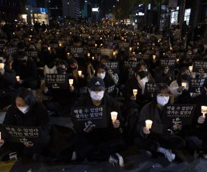 epa10287542 People attend a candlelight vigil for the victims of the Seoul Halloween stampede, in Seoul, South Korea, 05 November 2022. Some 20,000 people gathered to demand the punishment of those responsible within the government. At least 156 people died following a deadly stampede that occurred during Halloween celebrations in the Itaewon district of Seoul on 29 October.  EPA/JEON HEON-KYUN