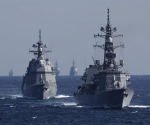 epa10289564 Japan's Maritime Self-Defense Force (JMSDF) destroyer Takanami (R) leads the JMSDF fleet during the International Fleet Review to commemorate the 70th anniversary of the foundation of the JMSDF, at Sagami Bay, off Yokosuka, south of Tokyo, Japan, 06 November 2022.  EPA/ISSEI KATO / POOL