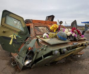 epa10292861 A damaged Ukrainian armoured personnel carrier (APC) with flowers on it put by local people in memory of the Ukrainian soldiers who died at this checkpoint, in the recently recaptured territory of the Kupiansk district, Kharkiv region, northeastern Ukraine, 07 November 2022, amid Russia's invasion. Kharkiv and surrounding areas have been the target of heavy shelling since February 2022, when Russian troops entered Ukraine starting a conflict that has provoked destruction and a humanitarian crisis. At the beginning of September 2022, the Ukrainian army pushed Russian forces from occupied territory in the northeast of the country in counterattacks.  EPA/SERGEY KOZLOV