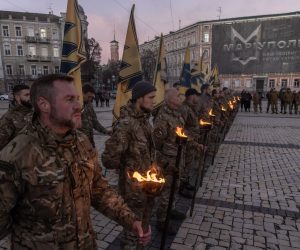 epa10304068 Members of the 'Azov' unit of the National Guard of Ukraine hold torches as they attend the event in memory of the 'Azov' fighters who lost their lives defending Ukraine, at Sophia Square, in downtown Kyiv, Ukraine, 13 November 2022. Members of Azov Regiment together with relatives and friends of those Azov fighters who were killed attended the event. During the siege of Mariupol, Azov played an important role in the city's defense. Russian troops entered Ukraine on 24 February 2022, starting a conflict that has provoked destruction and a humanitarian crisis.  EPA/ROMAN PILIPEY