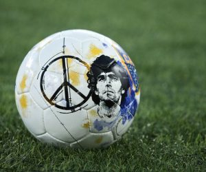 epa10305868 The official match ball with a portrait of late Argentinian player Diego Armando Maradona prior a tribute match in memory of late Argentinian player Diego Armando Maradona at the Olimpico stadium in Rome, Italy, 14 November 2022.  EPA/FEDERICO PROIETTI