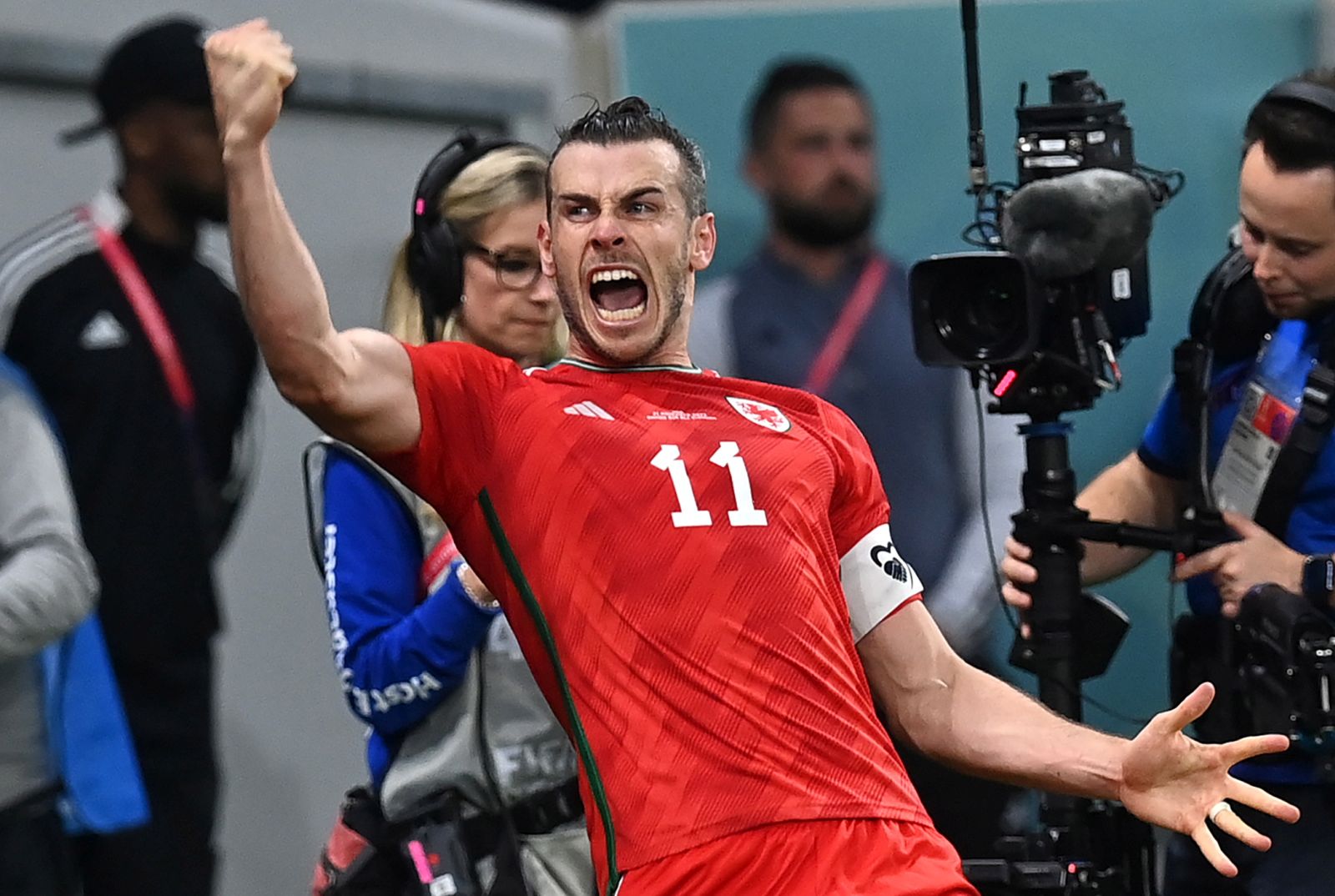 epa10319005 Gareth Bale of Wales celebrates after scoring the 1-1 with a penalty kick during the FIFA World Cup 2022 group B soccer match between the USA and Wales at Ahmad bin Ali Stadium in Doha, Qatar, 21 November 2022.  EPA/Neil Hall