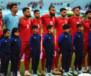 epa10317852 Players of Iran stand during their national anthem prior to the FIFA World Cup 2022 group B soccer match between England and Iran at Khalifa International Stadium in Doha, Qatar, 21 November 2022.  EPA/Neil Hall