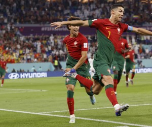 epa10325563 Cristiano Ronaldo of Portugal celebrates scoring the 1-0 by penalty during the FIFA World Cup 2022 group H soccer match between Portugal and Ghana at Stadium 947 in Doha, Qatar, 24 November 2022.  EPA/Rolex dela Pena