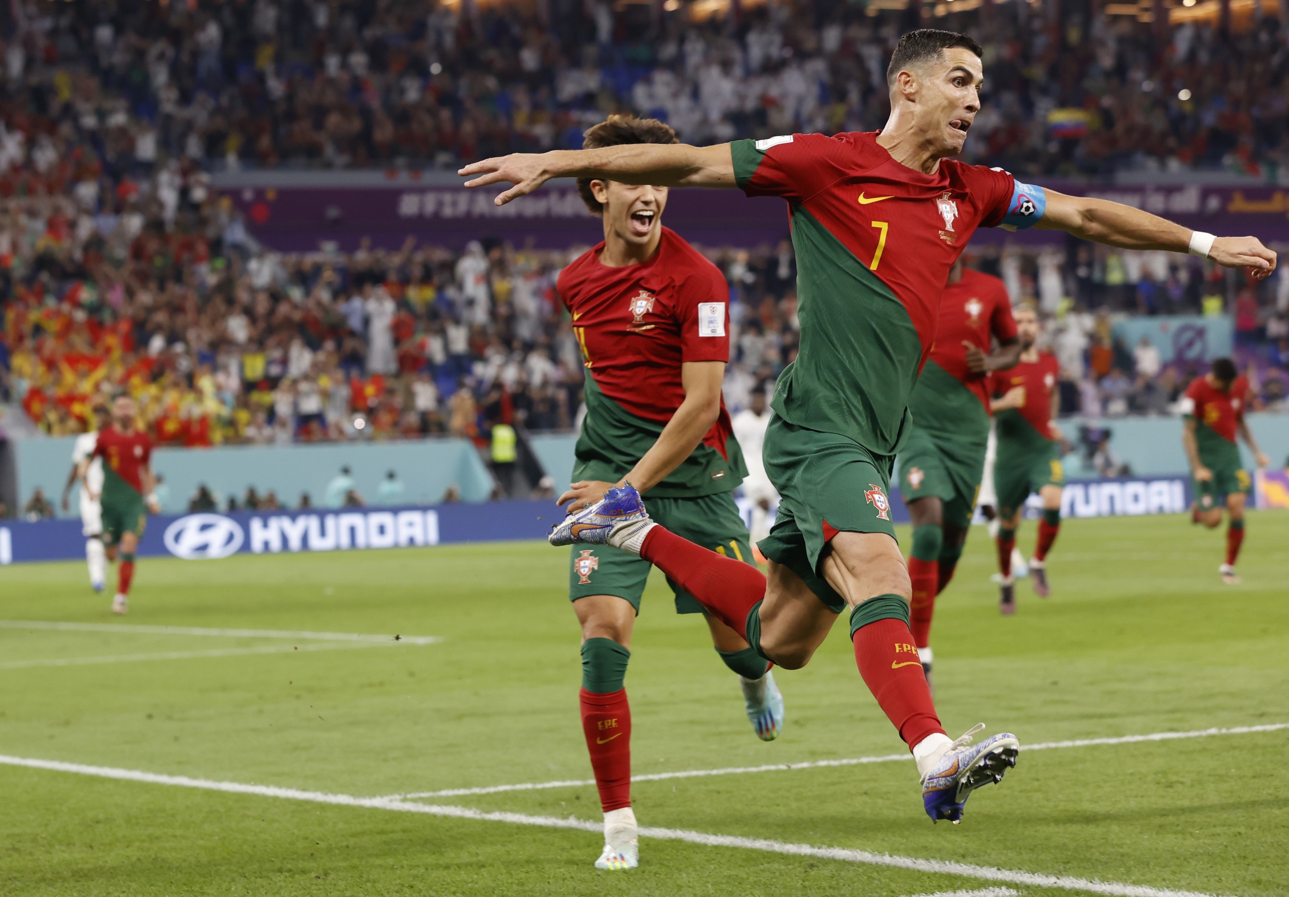 epa10325563 Cristiano Ronaldo of Portugal celebrates scoring the 1-0 by penalty during the FIFA World Cup 2022 group H soccer match between Portugal and Ghana at Stadium 947 in Doha, Qatar, 24 November 2022.  EPA/Rolex dela Pena