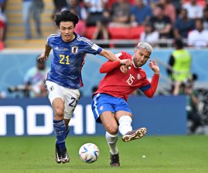 epa10331657 Ayase Ueda of Japan in action against Francisco Calvo (R) of Costa Rica during the FIFA World Cup 2022 group E soccer match between Japan and Costa Rica at Ahmad bin Ali Stadium in Doha, Qatar, 27 November 2022.  EPA/Noushad Thekkayil