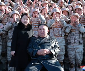 epa10331637 An undated photo released by the official North Korean Central News Agency (KCNA) on 27 November 2022 shows North Korean leader Kim Jong-un (front, C) posing with his daughter, presumed to be his second child, Ju-ae (C-L), during a photo session with the contributors to the successful test-fire of new-type ICBM Hwasongpho-17 at an undisclosed location in North Korea.  EPA/KCNA   EDITORIAL USE ONLY