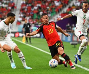 epa10332053 Eden Hazard (C) of Belgium in action against Moroccan players Achraf Hakimi (L) and Hakim Ziyech (R) during the FIFA World Cup 2022 group F soccer match between Belgium and Morocco at Al Thumama Stadium in Doha, Qatar, 27 November 2022.  EPA/Georgi Licovski