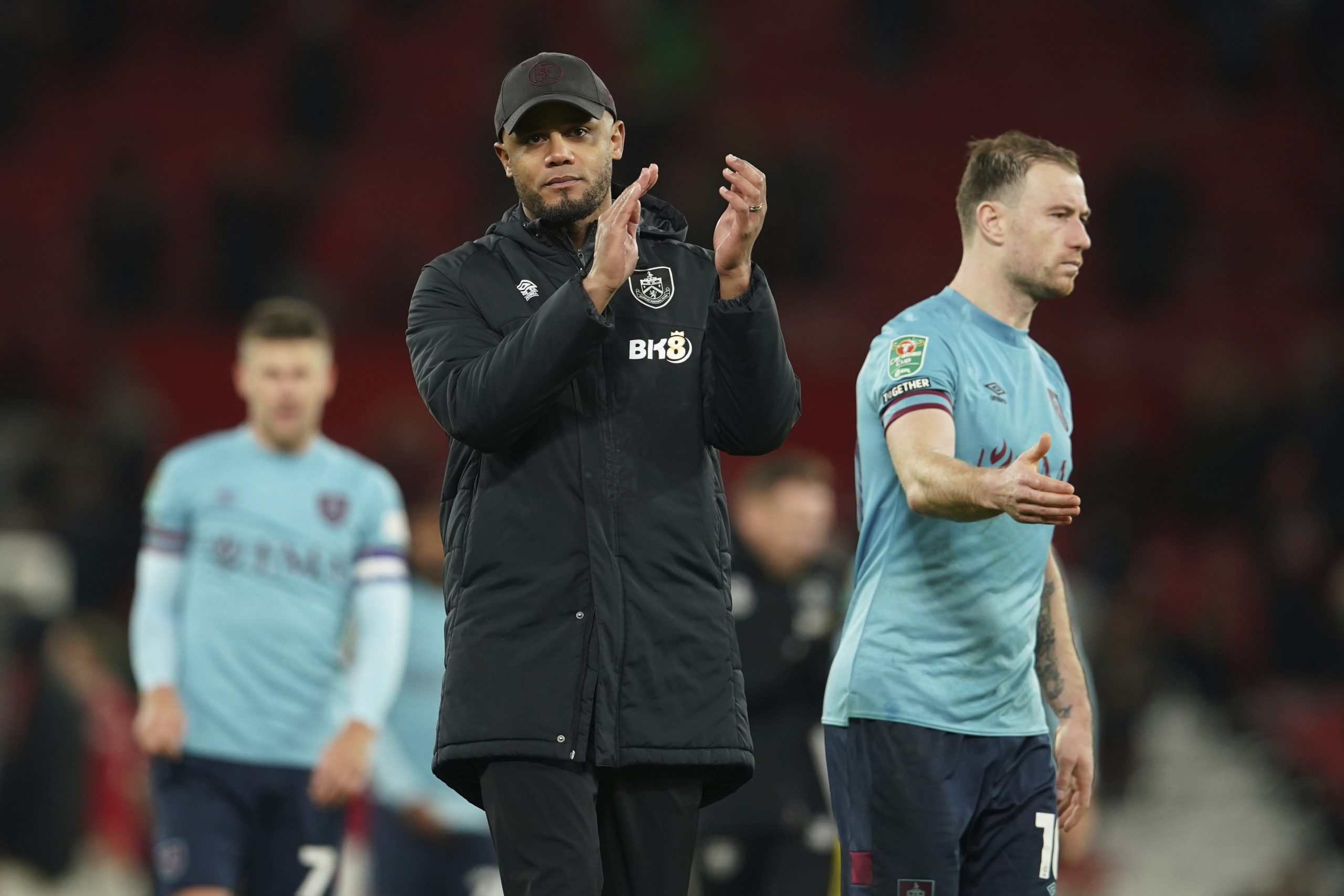 Burnley's manager Vincent Kompany applauds his teams fans after the end of the English League Cup 4th round soccer match between Manchester United and Burnley, at Old Trafford in Manchester, England Wednesday, Dec. 21, 2022. United won the game 2-0. (AP Photo/Dave Thompson)