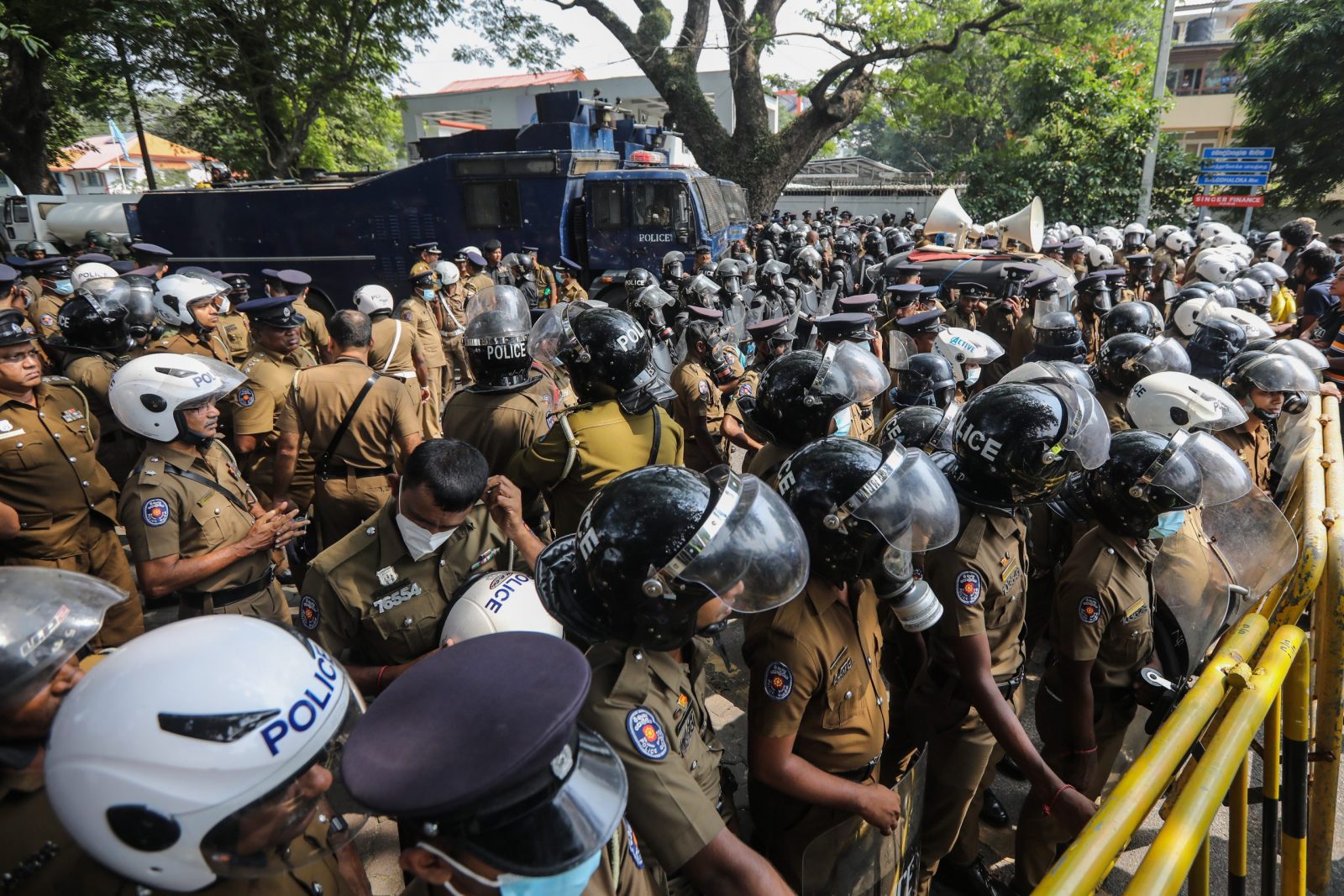 epa10312751 Sri Lankan riot police try to disperse a protest march demanding the release of protesters who had been detained under the Preventive Terrorism Act (PTA) in front of the United Nations compound in Colombo, Sri Lanka, 18 November 2022. Thousands of protesters staged a protest march to the United Nations compound in Colombo, demanding the release of protesters who had been detained under the Preventive Terrorism Act (PTA) for 90 days and against the government's crackdown on anti-government protesters using the PTA. Protests have been rocking Sri Lanka for over seven months as the country faces its worst-ever economic crisis in decades due to the lack of foreign reserves, resulting in severe shortages in food, fuel, medicine, and imported goods.  EPA/CHAMILA KARUNARATHNE