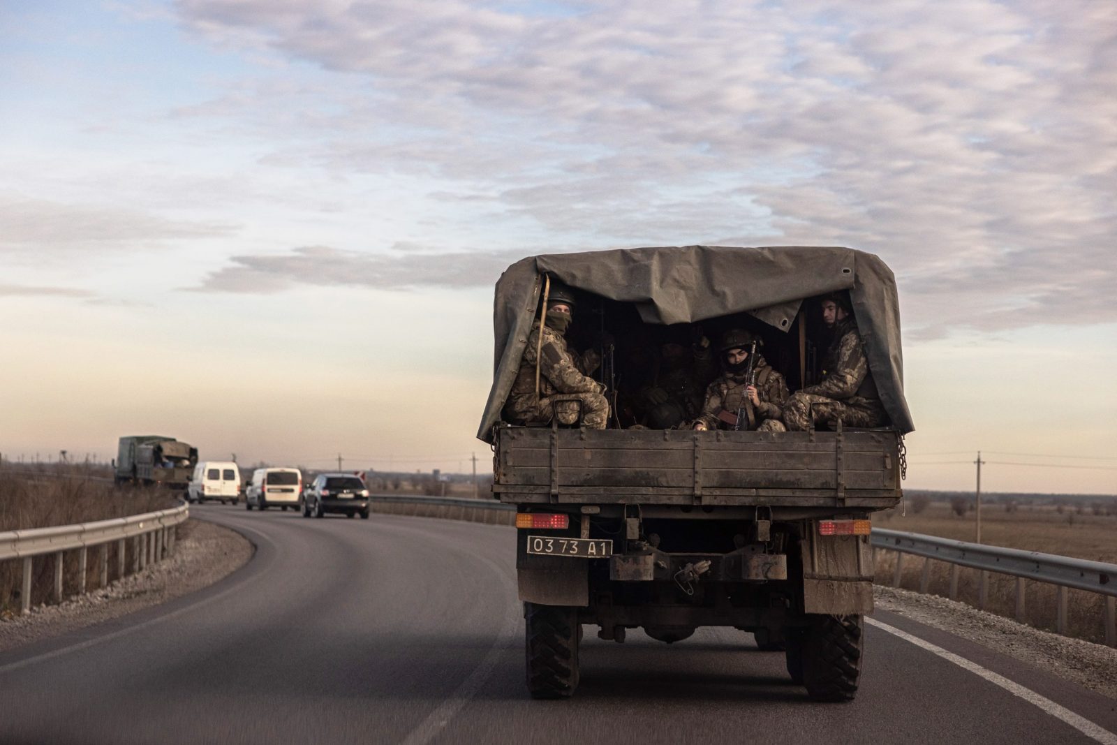 epa10342326 Ukrainian soldiers ride in a military truck in the Dnipropetrovsk region on the road to the Donetsk area, Ukraine, 01 December 2022, amid Russian invasion. Russian troops entered Ukraine on 24 February 2022 starting a conflict that has provoked destruction and a humanitarian crisis.  EPA/ROMAN PILIPEY