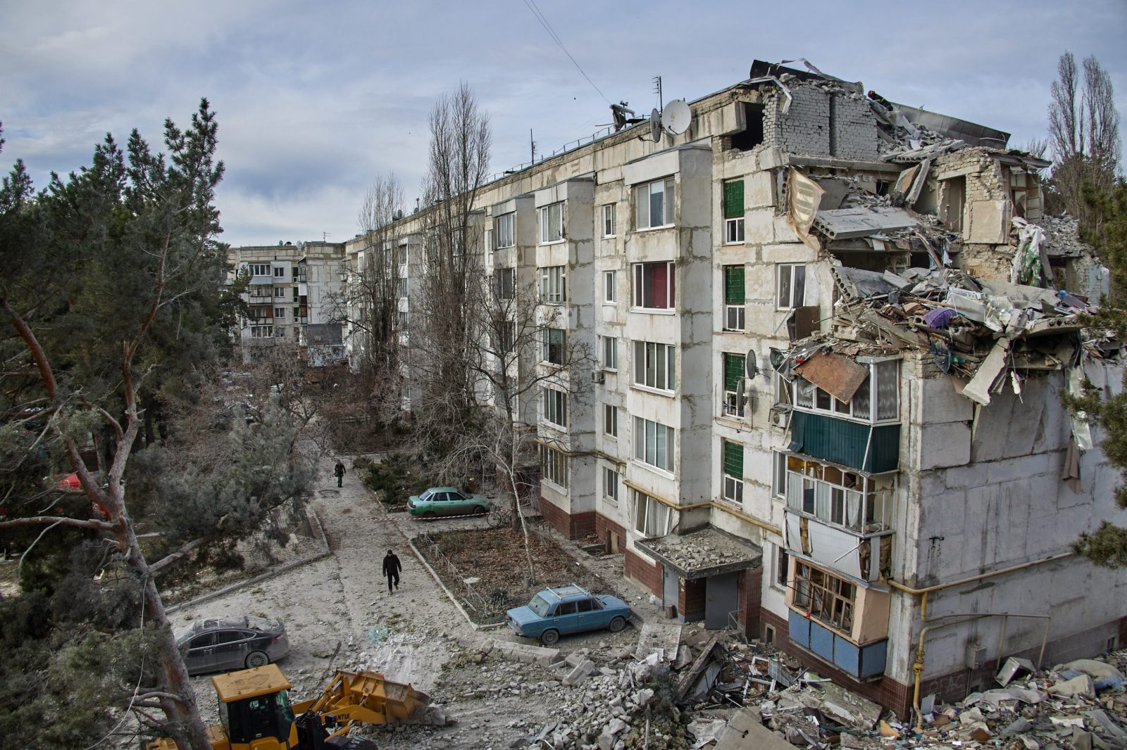epa10344318 Ukrainian rescuers work on a building that was destroyed during night shelling in the village of Kluhyno-Bashkyrivka near Chuhuiv, Kharkiv region, Ukraine, 02 December 2022. Kharkiv and surrounding areas have been the target of heavy shelling since February 2022, when Russian troops entered Ukraine starting a conflict that has provoked destruction and a humanitarian crisis. At the beginning of September, the Ukrainian army pushed Russian forces from occupied territory northeast of the country in counterattacks  EPA/SERGIY KOZLOV