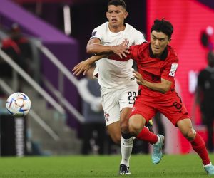 epa10344438 Inbeom Hwang (R) of South Korea in action against Matheus Nunes of Portugal during the FIFA World Cup 2022 group H soccer match between South Korea and Portugal at Education City Stadium in Doha, Qatar, 02 December 2022.  EPA/JOSE SENA GOULAO