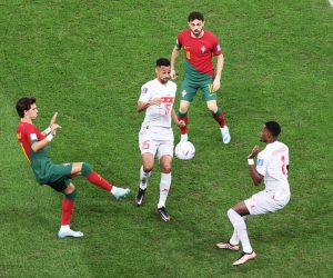 epa10352586 Bernardo Silva (top, C) and Joao Felix (L) of Portugal in action against Edimilson Fernandes (R) and Dijbril Sow of Switzerland (C) during the FIFA World Cup 2022 round of 16 soccer match between Portugal and Switzerland at Lusail Stadium in Lusail, Qatar, 06 December 2022.  EPA/Ali Haider