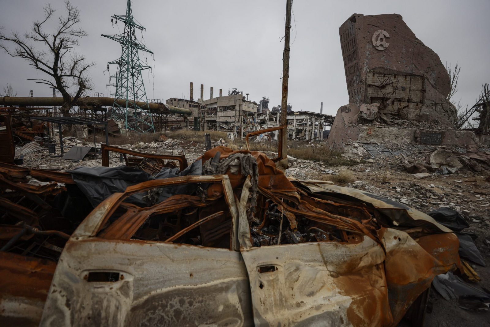 epaselect epa10354150 A destroyed monument with Azovstal logo at the main entrance to the Azovstal steel plant in Mariupol, eastern Ukraine, 07 December 2022. In April 2022, the Ukrainian forces that were still in the city, had retreated inside the Azovstal complex site. Mariupol had seen a long battle for its control between the Ukrainian forces and the Russian army and Russian backed separatist Donetsk People’s Republic (DPR) as well as a siege, the hostilities lasted from February to the end of May 2022 killing thousands of people and destroying most of the city in the process. According to the DPR government which took control after May 2022, more than five thousand builders are currently working in Mariupol, they expect the city to be completely rebuilt in a three years time.  EPA/SERGEI ILNITSKY