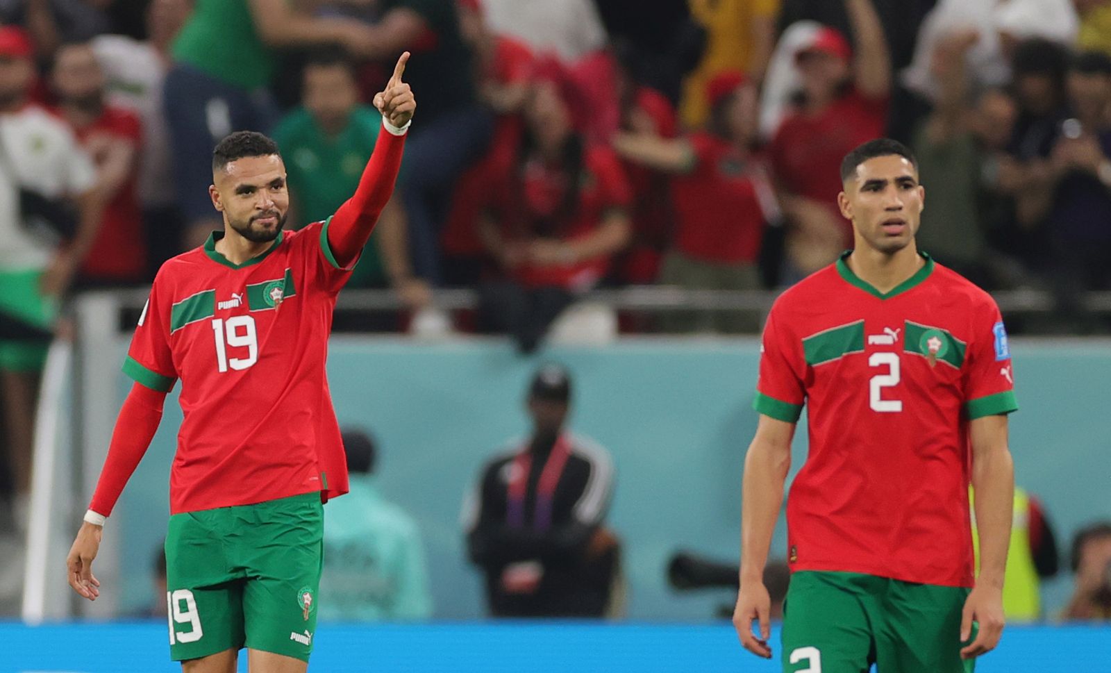 epa10359361 Youssef En-Nesyri of Morocco (L) celebrates scoring the 1-0 during the FIFA World Cup 2022 quarter final soccer match between Morocco and Portugal at Al Thumama Stadium in Doha, Qatar, 10 December 2022.  EPA/Friedemann Vogel