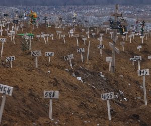 epa10360629 Numbers mark the graves of unidentified local residents who were killed during fights in the city on the cemetery in Mariupol, Ukraine, 10 December 2022 (issued 11 December 2022). An estimate 250,000 inhabitants have left the city, about 300,000 still remain. During the hostilities, up to 70 percent of the housing stock of Mariupol was destroyed and about 5,000 civilians were killed due to fighting and shelling, Konstantin Ivashchenko, the new mayor of the city, said. City authorities prepare residential buildings for winter and change all central heating systems in Mariupol, where by the end of the year at least 1,000 residential buildings, social and cultural facilities will be connected to heat, said Russian Deputy Prime Minister Marat Khusnullin. The government of the self-proclaimed Donetsk People's Republic (DPR) reported that 129,000 square meters of new housing will appear next year in Mariupol. More than 5,000 builders are working on the restoration of the city. Mariupol is expected to be completely rebuilt in three years.  EPA/SERGEI ILNITSKY