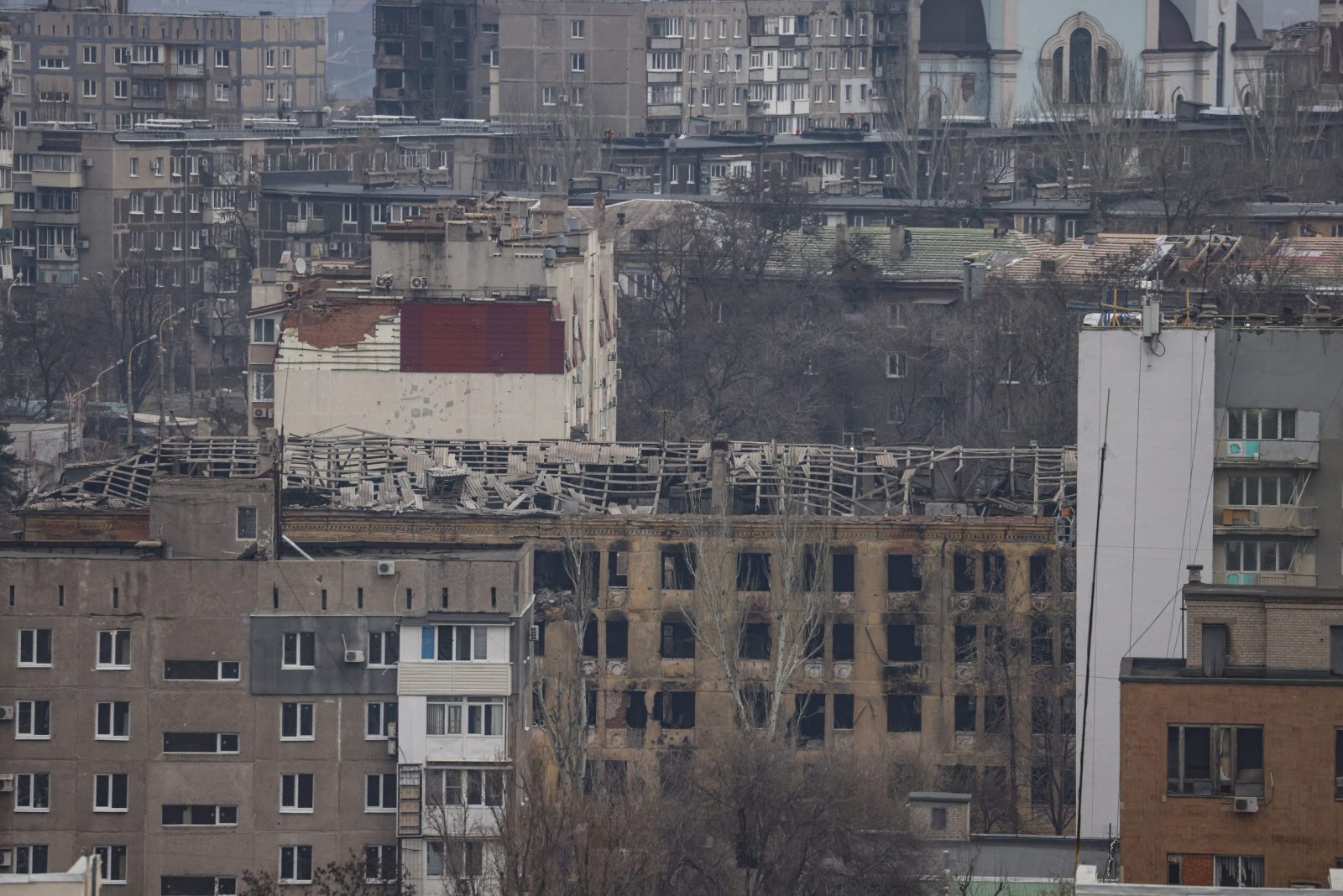 epa10360631 A general view of the buildings in Mariupoll, Ukraine, 10 December 2022 (issued 11 December 2022). An estimate 250,000 inhabitants have left the city, about 300,000 still remain. During the hostilities, up to 70 percent of the housing stock of Mariupol was destroyed and about 5,000 civilians were killed due to fighting and shelling, Konstantin Ivashchenko, the new mayor of the city, said. City authorities prepare residential buildings for winter and change all central heating systems in Mariupol, where by the end of the year at least 1,000 residential buildings, social and cultural facilities will be connected to heat, said Russian Deputy Prime Minister Marat Khusnullin. The government of the self-proclaimed Donetsk People's Republic (DPR) reported that 129,000 square meters of new housing will appear next year in Mariupol. More than 5,000 builders are working on the restoration of the city. Mariupol is expected to be completely rebuilt in three years.  EPA/SERGEI ILNITSKY