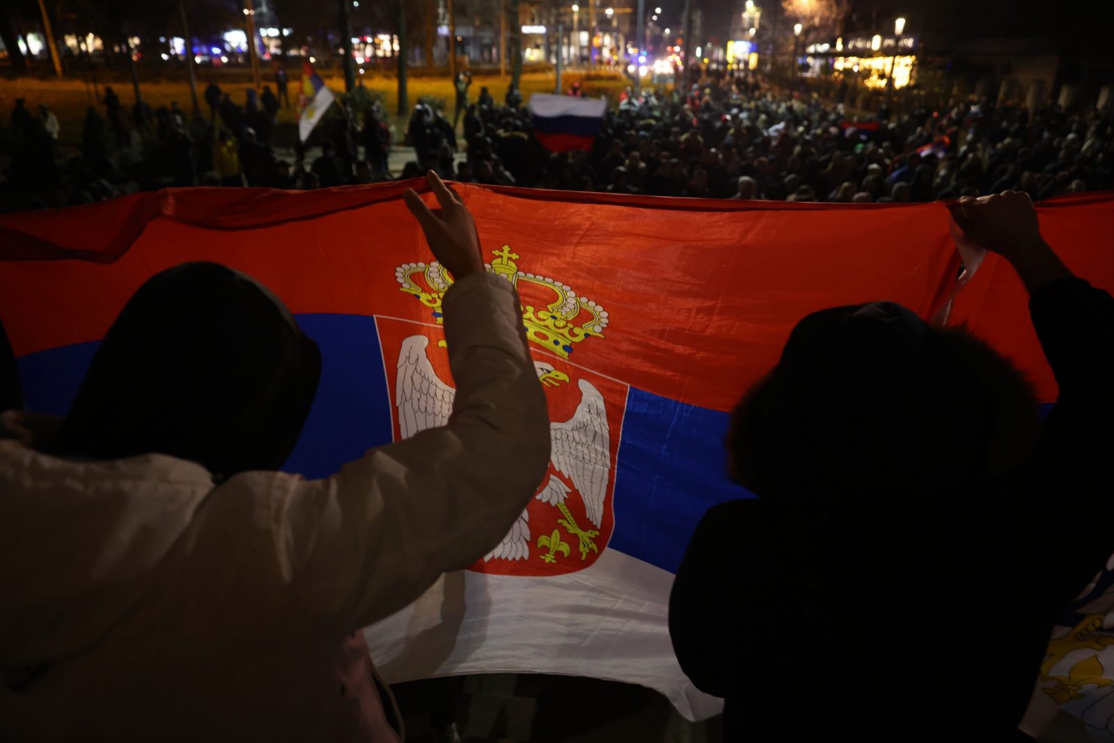 epa10362546 Protesters hold a Serbian flag during a march of support for Serbian population in Kosovo, in Belgrade, Serbia, 12 December 2022. Tensions between Kosovo and Serbia expanded after ethnic Serbs in Kosovo's north built road-blocks on the main roads in a protest after the arrest of a former Kosovo police officer of Serbian ethnicity on charges of terrorism.  EPA/ANDREJ CUKIC