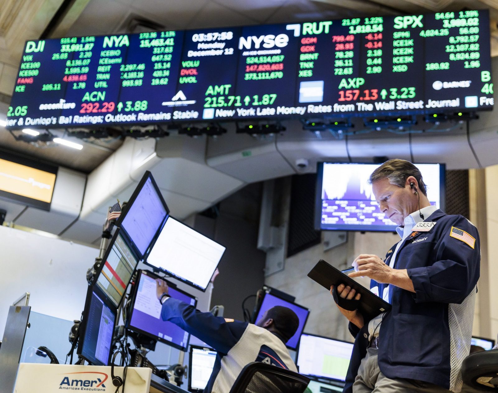 epa10362622 A trader works at the Closing Bell on the floor of the New York Stock Exchange in New York, New York, USA, on 12 December 2022. The Dow Jones Industrial Average closed the day up over 500 points.  EPA/JUSTIN LANE