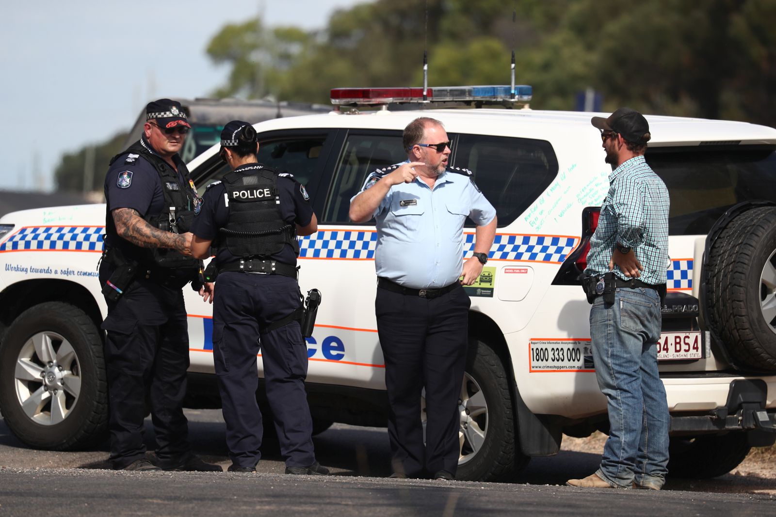 epa10362634 Police work near the scene of a fatal shooting in Wieambilla, Queensland, Australia, 13 December 2022. Police have shot dead three people at a remote property on Queensland's Darling Downs after an ambush in which two officers and a bystander were killed.  EPA/JASON O’BRIEN  AUSTRALIA AND NEW ZEALAND OUT