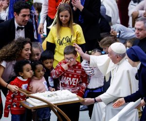 epa10371447 A cake is brought for Pope Francis' 86th birthday during an audience with children assisted by Santa Marta dispensary, at the Vatican, 18 December 2022. Pope Francis attended the pre-Christmas event with a group of children and their parents who are assisted by the Vatican's Santa Marta Paediatric Dispensary. Pope Francis turned 86 on 17 December 2022.  EPA/FABIO FRUSTACI