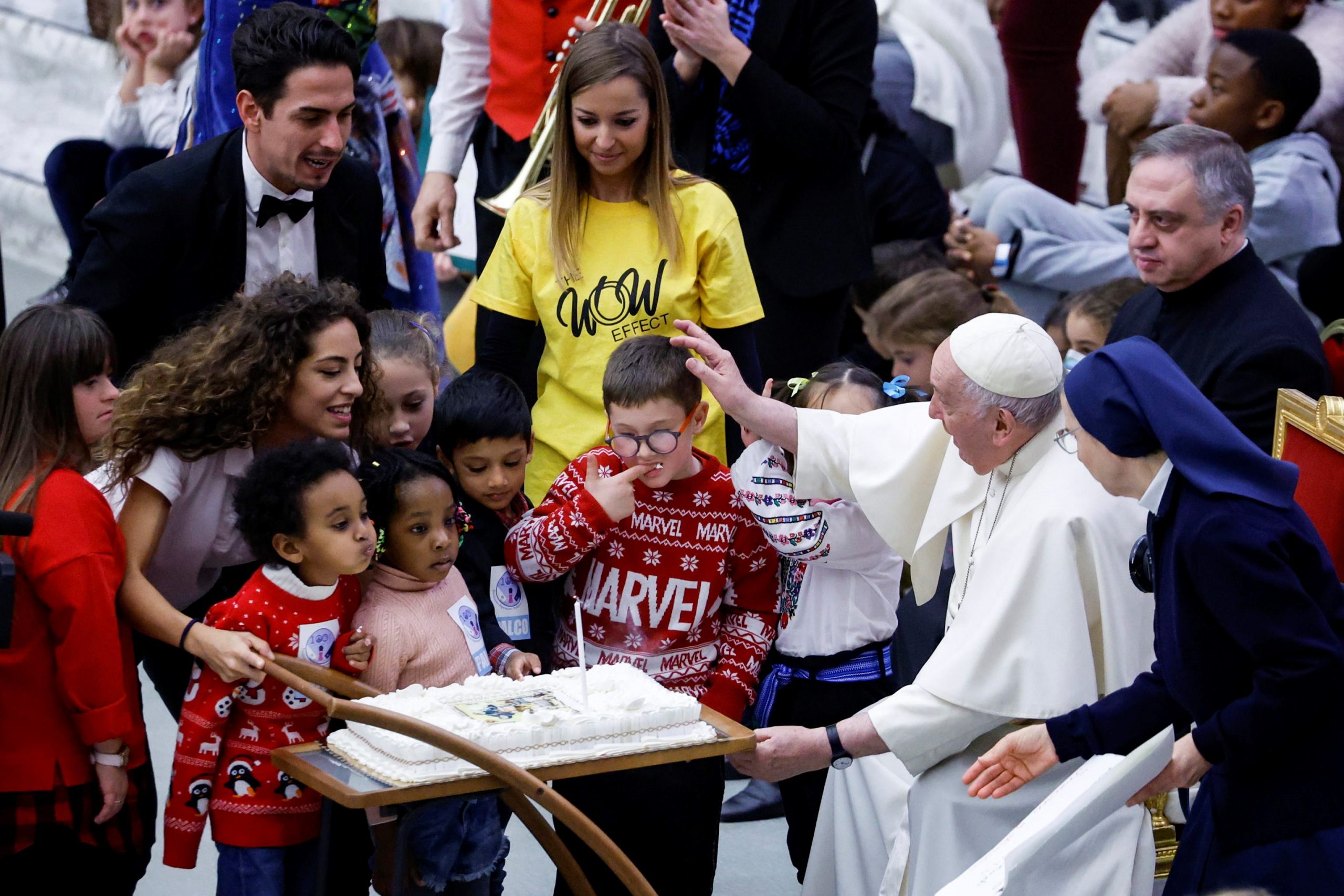 epa10371447 A cake is brought for Pope Francis' 86th birthday during an audience with children assisted by Santa Marta dispensary, at the Vatican, 18 December 2022. Pope Francis attended the pre-Christmas event with a group of children and their parents who are assisted by the Vatican's Santa Marta Paediatric Dispensary. Pope Francis turned 86 on 17 December 2022.  EPA/FABIO FRUSTACI