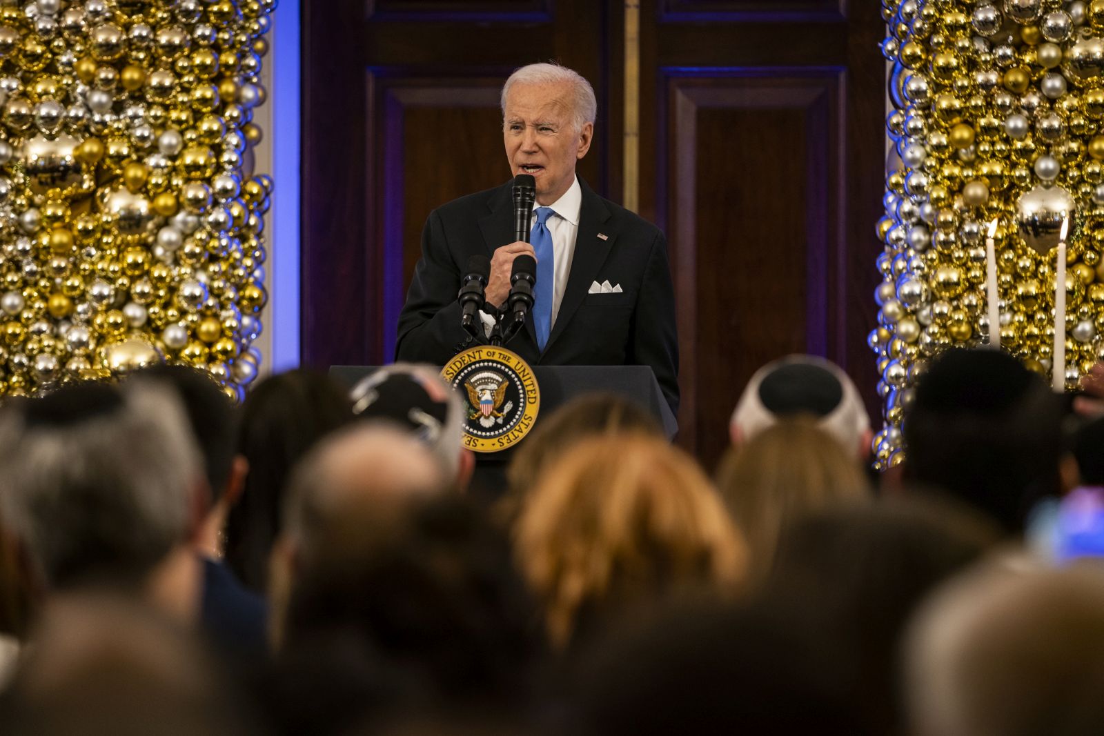 epa10374347 US President Joe Biden speaks during a Hanukkah Holiday Reception in the Grand Foyer of the White House, in Washington, DC, USA, 19 December 2022.  EPA/Samuel Corum / POOL