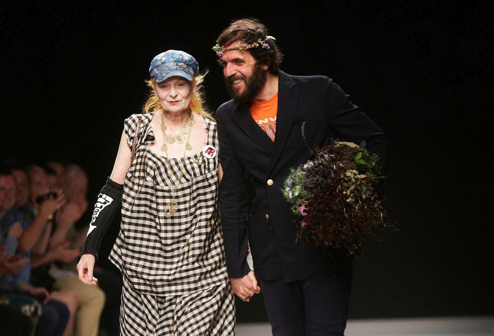 epa10381971 (FILE) - British fashion designer Vivienne Westwood (L) and husband Andreas Kronthaler (R) acknowledge the audience after the presentation of her  Spring/Summer 2013 Men's collection during the Milan Fashion Week, in Milan, Italy, 24 June 2012 (reissued 29 December 2022). Vivenne Westwood died on 29 December 2022 at the age of 81, according to a statement posted on her social media accounts.  EPA/MATTEO BAZZI *** Local Caption *** 50402100