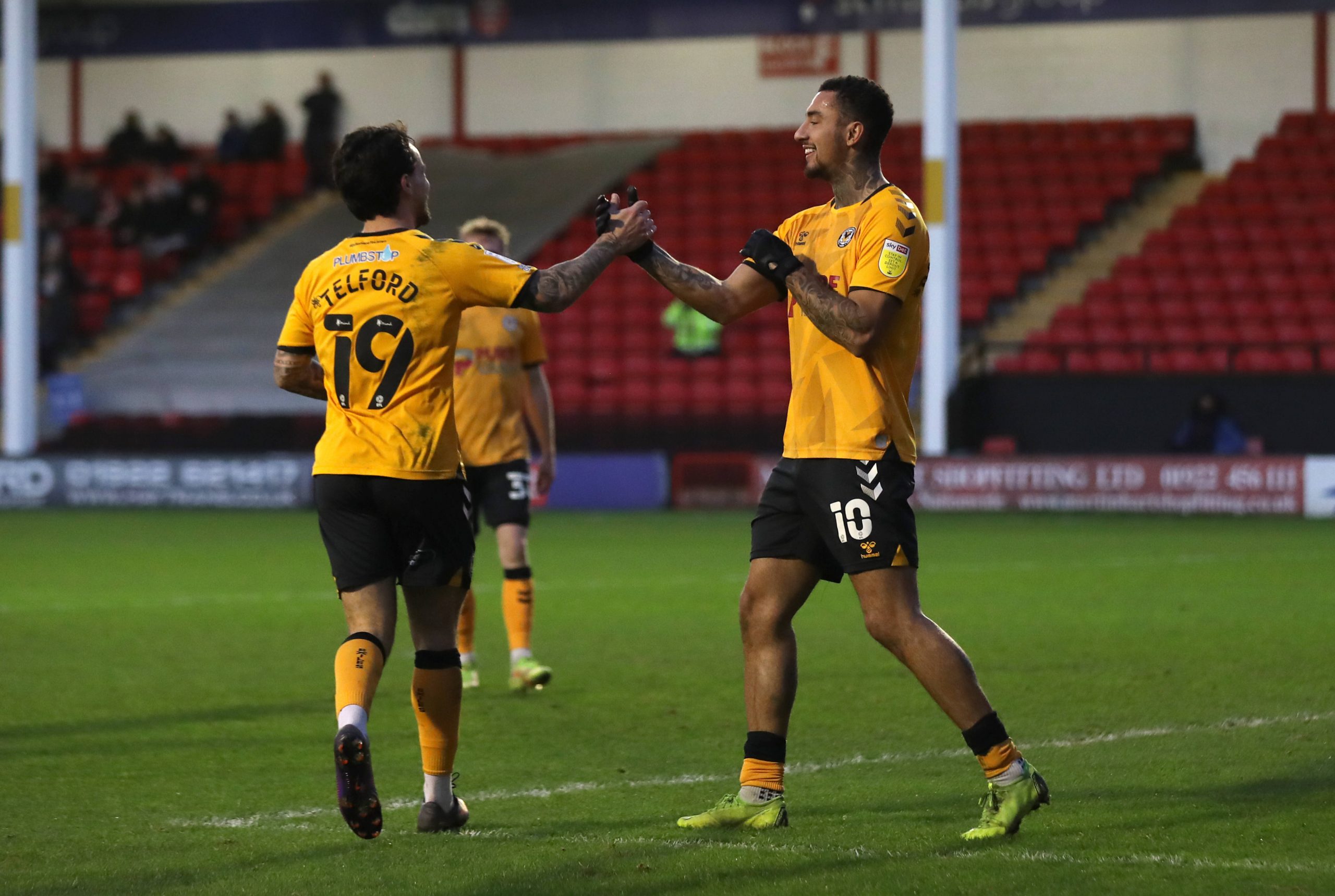 Walsall v Newport County - Sky Bet League Two - Banks s Stadium Newport County s Dominic Telford left celebrates with Courtney Baker-Richardson after Walsall s Conor Wilkinson not pictured scores an own goal during the Sky Bet League Two match at Banks s Stadium, Walsall. Picture date: Saturday January 1, 2022. EDITORIAL USE ONLY No use with unauthorised audio, video, data, fixture lists, club/league logos or live services. Online in-match use limited to 120 images, no video emulation. No use in betting, games or single club/league/player publications. PUBLICATIONxNOTxINxUKxIRL Copyright: xBradleyxCollyerx 64556674