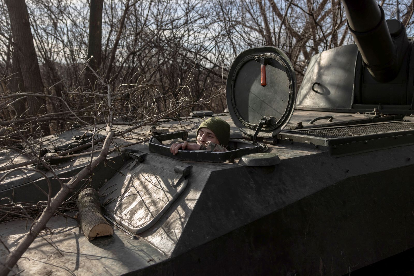 epa10345159 A Ukrainian soldier looks out from a self-propelled howitzer 2S1 Gvozdika near the frontline town of Bakhmut, in Donetsk region, Ukraine, 02 December 2022. Bakhmut, has been a place of fierce fighting between the Ukrainian and Russian troops with a large number of casualties. Russian troops entered Ukraine on 24 February 2022 starting a conflict that has provoked destruction and a humanitarian crisis.  EPA/ROMAN PILIPEY