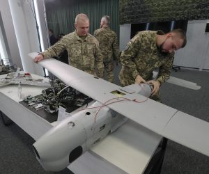 epa10367195 Ukrainian servicemen dismantle parts of drones used in Russian strikes, shown to the media during a briefing by the representatives of the Security and Defense Forces of Ukraine at the Military Media Center in Kyiv, Ukraine, 15 December 2022.According to the speakers of the briefing, different types of drones, reconnaissance and kamikaze drones, are used by the Russian army in shellings in Ukraine. The representatives of the Security and Defense Forces of Ukraine held a briefing about operations at the front of the Russian-Ukrainian war and the security situation in Ukraine some ten months after Russian troops entered Ukrainian territory, starting a conflict that has provoked destruction and a humanitarian crisis.  EPA/SERGEY DOLZHENKO