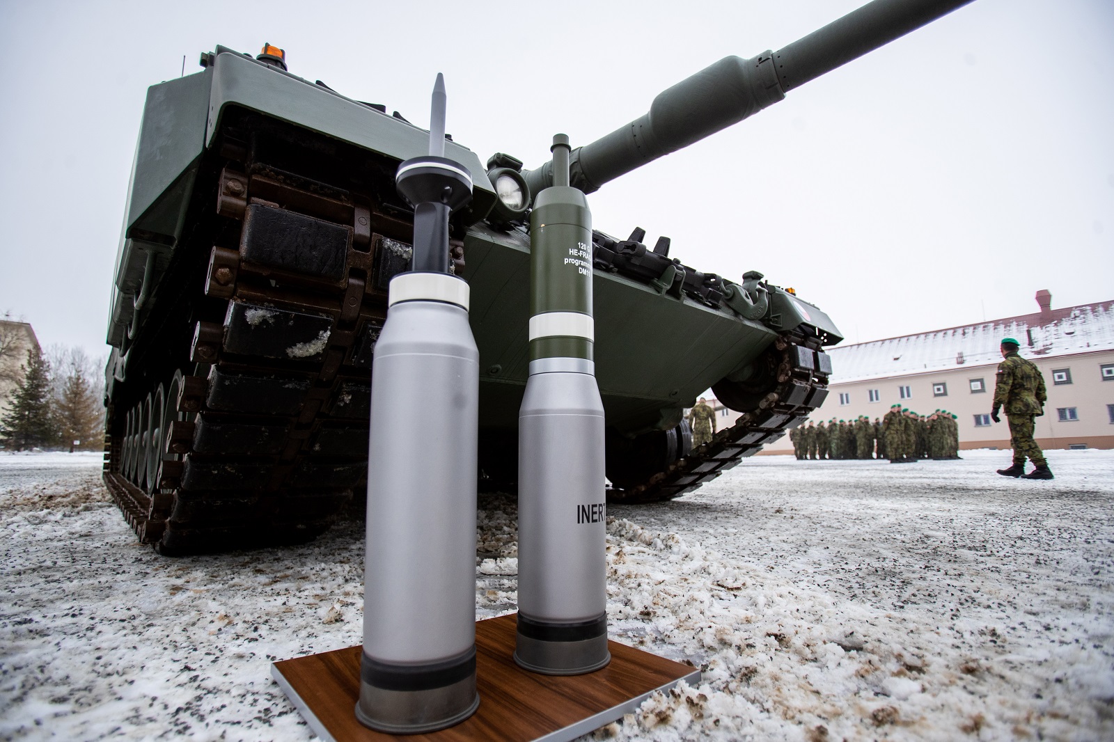 epa10375564 Ammunition standing in front of a Leopard 2A4 tank during a ceremony for the hand over of the symbolic key of the tank to the Czech army, in Praslavice, Czech Republic, 21 December 2022. The Czech Republic is to receive a total of 14 Leopard 2A4 tanks and a Bueffel armored recovery vehicle as a gift from Germany under the German government's 'Ringtausch' programme in return for deliveries of older tanks from Czech army depots to Ukraine. In addition to the tanks, the delivery will include an initial package of spare parts, ammunition and a three-year service support from the supplier, which includes training of Czech soldiers. The value of the donation exceeds 3.85 billion Czech crown (159 million euro). The rest of the military equipment is expected to be delivered to the Czech Republic next year.  EPA/VLADIMIR PRYCEK