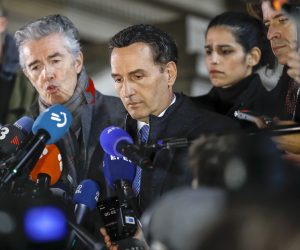 epa10376203 Andre Risopoulos (L) and Michalis Dimitrakopoulos (C), lawyers of Eva Kaili, speak to the media after a pre-trial court hearing in Brussels, Belgium, 22 December 2022. Kaili was dismissed on 13 December from the vice presidency of the European Parliament over allegations of corruption. The Greek MEP and three other suspects were arrested by Belgian police as part of an investigation into suspected corruption and money laundering.  EPA/OLIVIER HOSLET