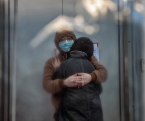 epa10376992 A couple stand in a makeshift fever clinic in front of the hospital, in Shanghai, China, 23 December 2022. Hospitals in China struggle to cope due to the rising number of COVID-19 cases. Since the abrupt lifting of domestic COVID-19 restrictions, cases have rocketed in China, causing businesses to close because employees are sick, schools are shifting to online classes, and pharmacies are struggling with the high demand. On 21 December, Shanghai Deji Hospital’s official WeChat account published a post with an estimated 5.43 million positive cases in the city and predicted that 12.5 million could get infected by the end of the year. The day after, the post was no longer available.  EPA/ALEX PLAVEVSKI
