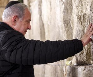 epa10385708 Israel's Prime Minister Benjamin Netanyahu prays as he visits the Western Wall -- the holiest site where Jews are allowed to pray -- to mark the swearing-in of the 37th government of Israel, in the old city of Jerusalem, 01 January 2023.  EPA/GIL COHEN-MAGEN / POOL