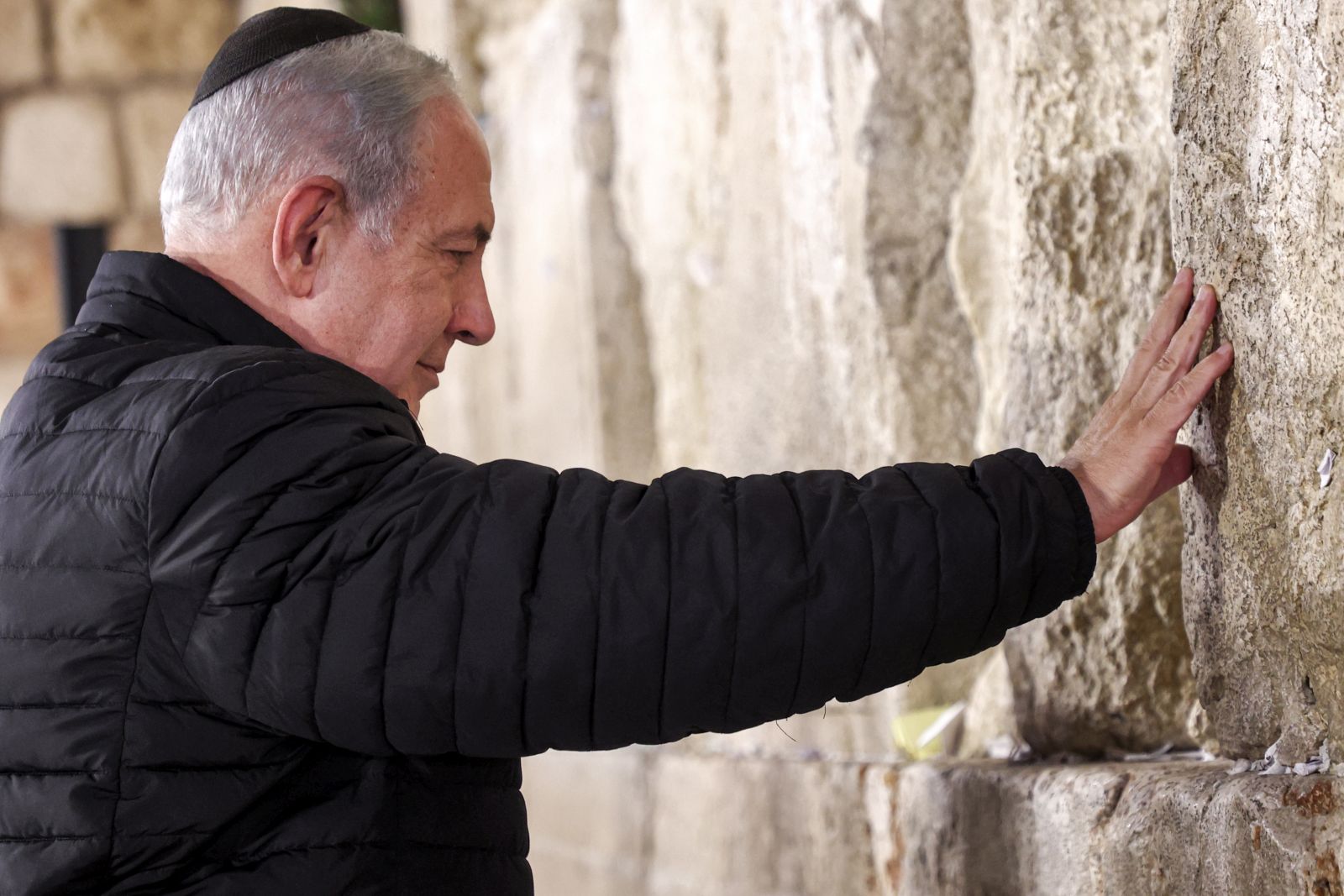 epa10385708 Israel's Prime Minister Benjamin Netanyahu prays as he visits the Western Wall -- the holiest site where Jews are allowed to pray -- to mark the swearing-in of the 37th government of Israel, in the old city of Jerusalem, 01 January 2023.  EPA/GIL COHEN-MAGEN / POOL