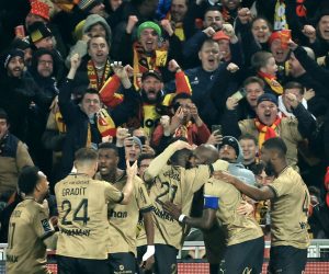 epa10385762 Players of Lens celebrate the 1-0 goal during the French Ligue 1 soccer match between RC Lens and Paris Saint Germain in Lens, France, 01 January 2023.  EPA/CHRISTOPHE PETIT TESSON