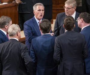 epa10387830 House Republican Leader Kevin McCarthy talks with colleagues as the results of the second vote for Speaker of the House is tabulated during the opening session of the 118th Congress on the House floor in the US Capitol in Washington, DC, USA 03 January 2023. House Republican Leader Kevin McCarthy is facing serious opposition from his own Republican caucus putting his bid for Speaker of the House in jeopardy.  EPA/SHAWN THEW