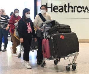 epa10390386 Travellers arrive at Heathrow Airport in London, Britain, 05 December 2023. From 05 January 2023, people traveling from China to the UK will need to show a negative Covid-19 test taken no more than two days prior to departure.  EPA/Neil Hall