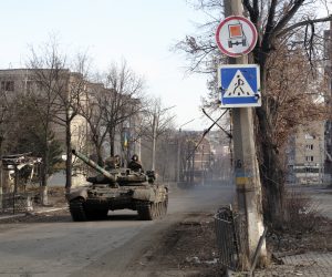 epa10390837 Ukrainian forces drive a tank across a street in the city of Bakhmut, Donetsk area, Ukraine, 04 January 2023 (issued 05 January 2023). Heavy fighting is taking place in the region. Russian troops entered Ukraine on 24 February 2022 starting a conflict that has provoked destruction and a humanitarian crisis.  EPA/GEORGE IVANCHENKO