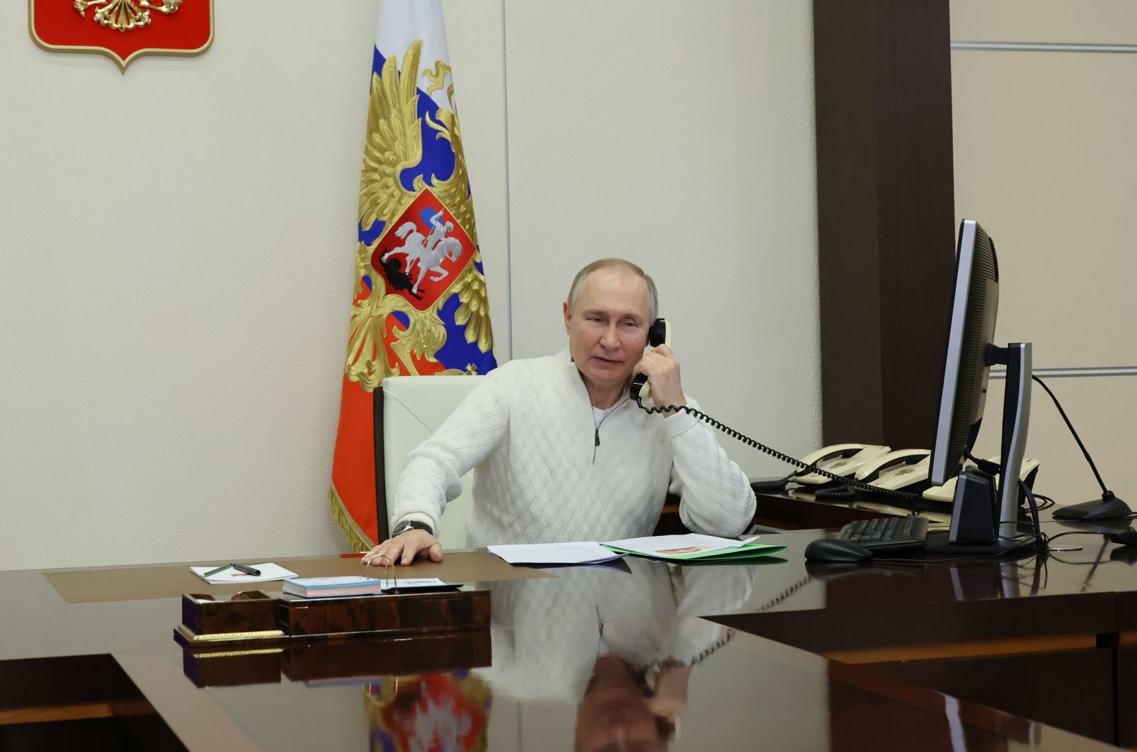 epa10391046 Russian President Vladimir Putin speaks on the phone to seven-year-old David Shmelev from Stavropol Krai region, who took part in the New Year Tree of Wishes nationwide charity campaign, at the Novo-Ogaryovo state residence, outside Moscow, Russia, 05 January 2023. Putin on 05 January called for a 36-hour ceasefire in Ukraine to mark Orthodox Christmas.  EPA/MIKHAEL KLIMENTYEV / SPUTNIK / KREMLIN POOL MANDATORY CREDIT