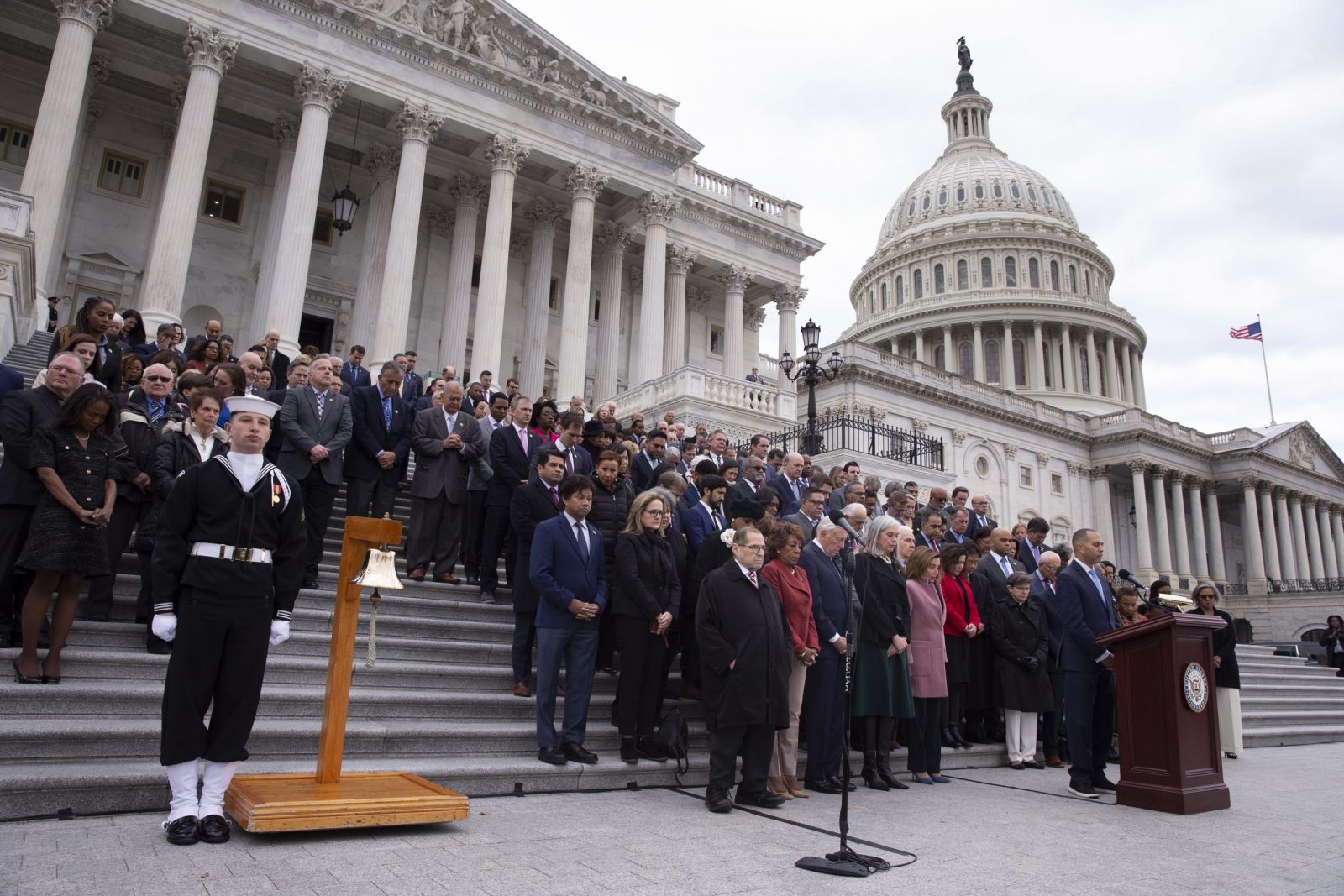 epa10392701 Members of Congress and families of fallen US Capitol Police observe a moment of silence during a ceremony to observe the second anniversary of the 06 January attack on the United States Capitol, at the East Front steps of the US Capitol in Washington, DC, USA, 06 January 2023. The second anniversary of the attack by insurrections occurs weeks after the House Select Committee to Investigate the January 6 Attack on the Capitol referred former US President Donald J. Trump and others to the US Justice Department for criminal investigations.  EPA/MICHAEL REYNOLDS