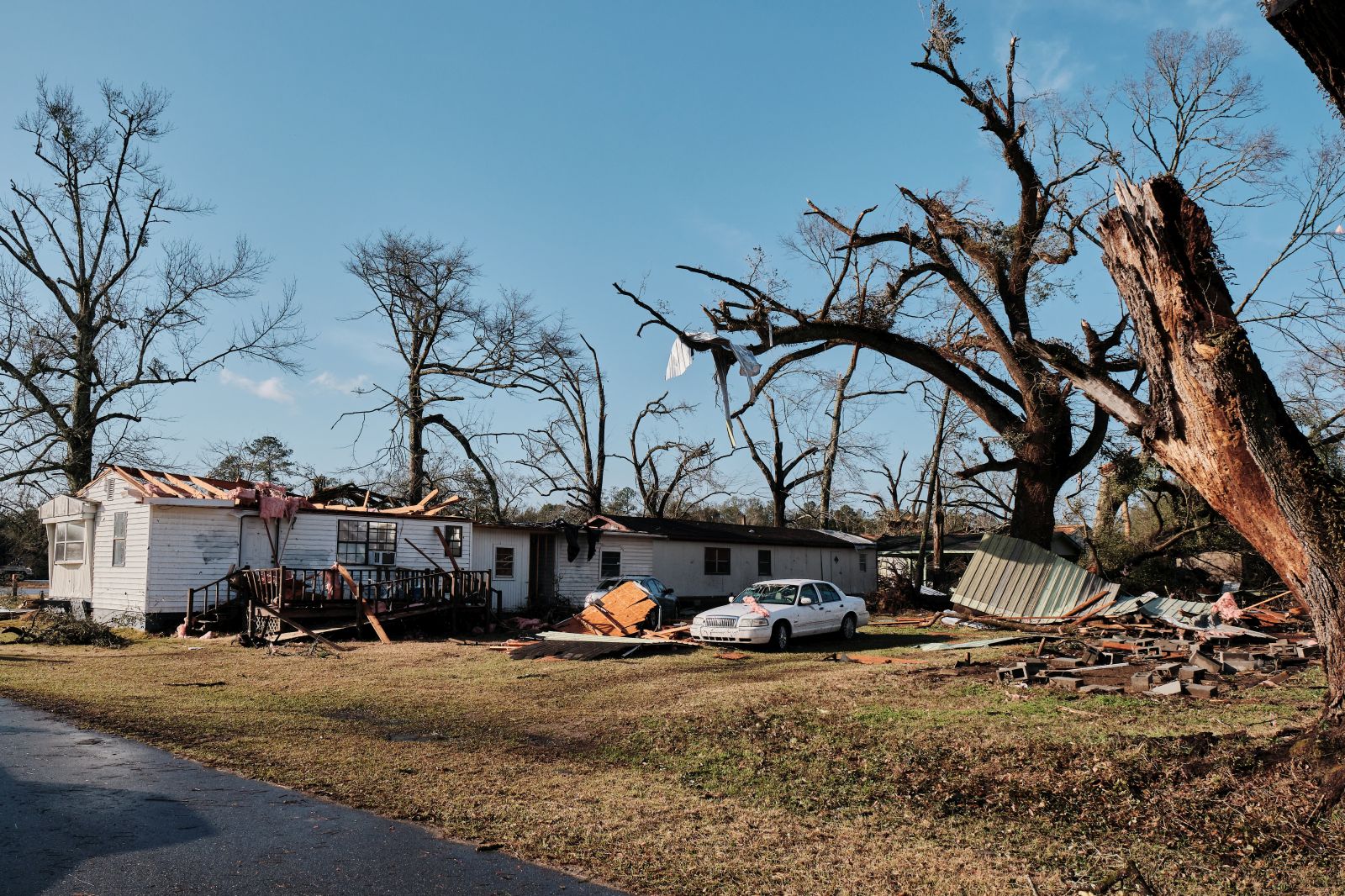 epa10402276 A trailer home with the roof ripped off from a tornado sits among the damage from a run of storms making their way through the South East of the US, in Mount Vernon, Alabama, USA, on 12 January 2023.  EPA/DAN ANDERSON